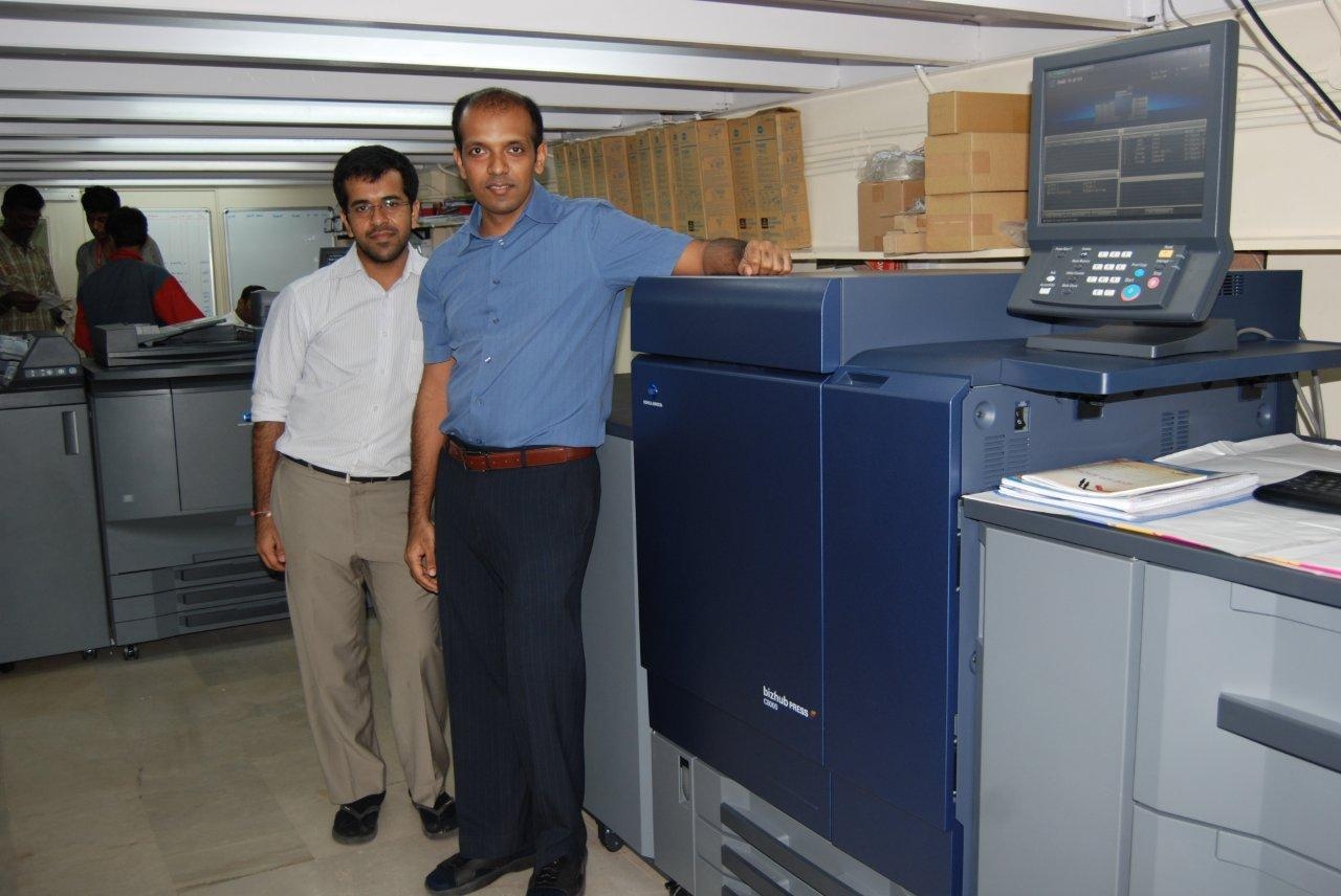 "Bizhub C8000 offers printing on versatile media," says Milap Shah of PrintStop