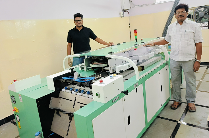 Sai Ratna team operating the Bindwel@2500 six-clamp perfect binding machine for high-volume book and commercial print production