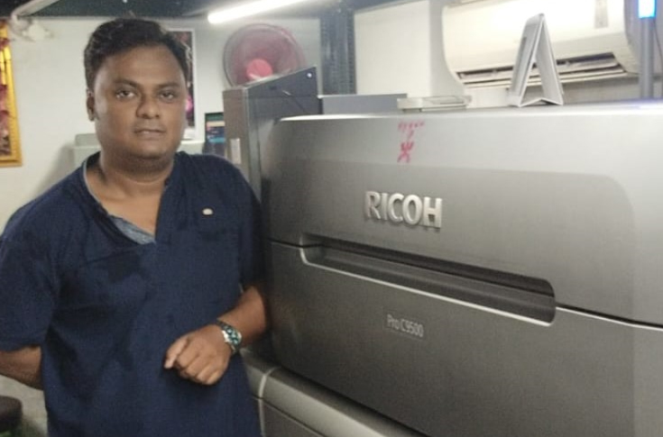 Business case study on Kolkata-based New Diya Digital and Diya Digital adopting Ricoh Pro C9500 digital printing press through Minosha, highlighting improvements in barcode and label printing, variable data capabilities, higher production volume, enhanced print quality, and increased efficiency after installation