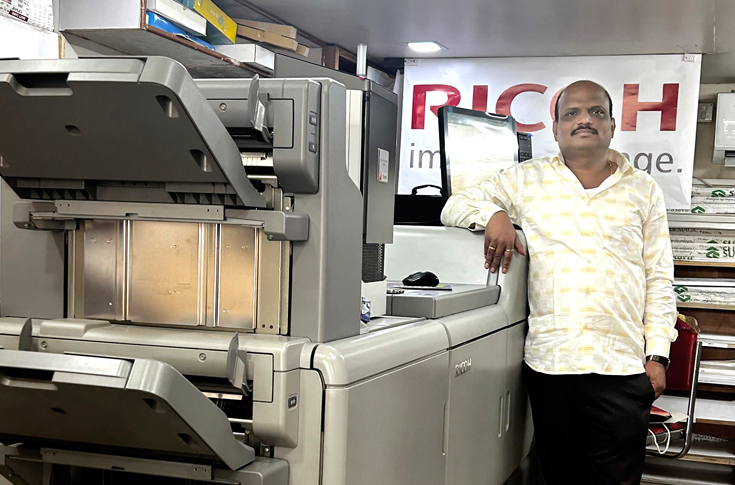 Gawade Enterprises printing facility in Pune using Ricoh Pro C7200x and Ricoh production printers supported by Minosha India, showcasing commercial print production of brochures, cards, and flyers with advanced special colour printing