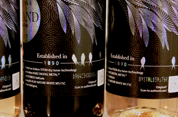 Xeikon label printing system integrated with Kurz digital metal embellishment and Scribos security technology enabling anti-counterfeiting QR codes and variable metallic authentication features for secure packaging labels