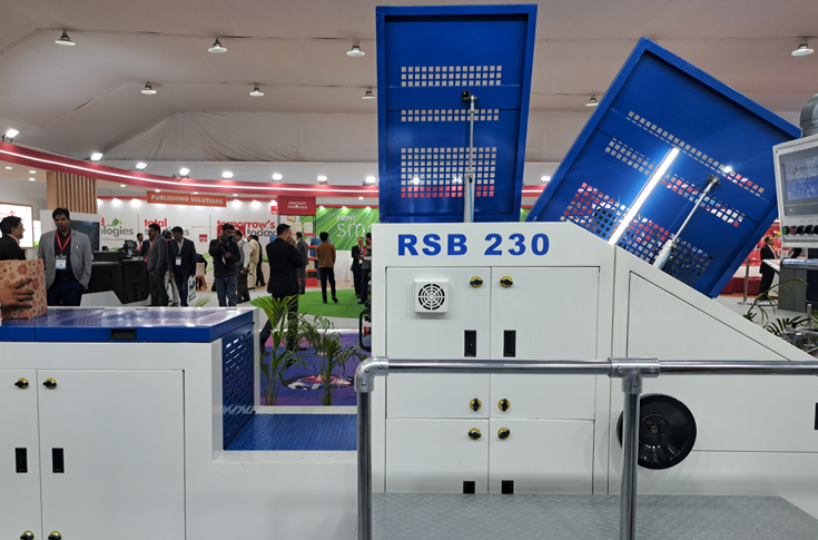 Ronald Machines Worldwide displays a V-bottom paper bag making machine at PrintPack 2025, capable of producing 230 bags per minute with fast size changeover and high production efficiency