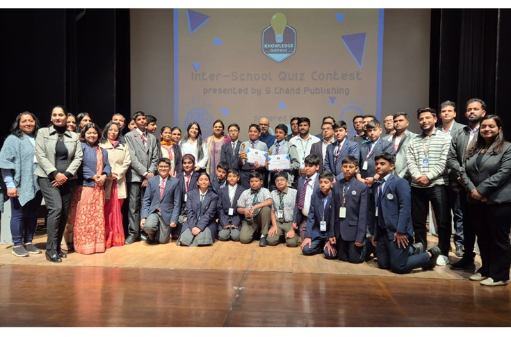 Students and educators at the Knowledge Quest Quiz finale by S Chand Publishing at Delhi Public School, celebrating nationwide academic competition and student achievements.