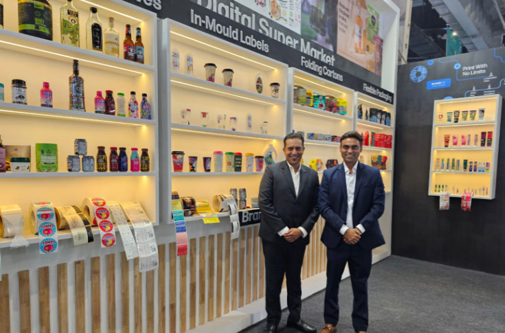 HP Digital Supermarket demonstrating multi-application printing including labels, cartons, in-mould labels, shrink sleeves, lamitubes, and flexible packaging using a six-in-one printing system