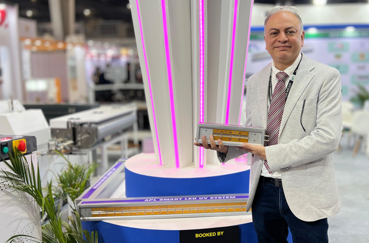 APL Machinery team showcasing cast-and-cure, roll-to-roll foiling, LED, and screen printing machines at PrintPack 2025 after securing multiple machine sales