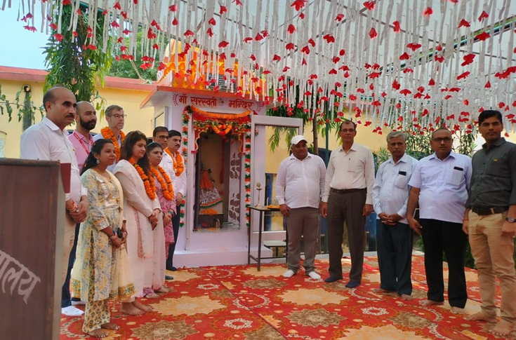 Renovated rural school building with new classrooms, desks, and facilities, showing students attending classes in a safe, improved learning environment supported by corporate social initiative