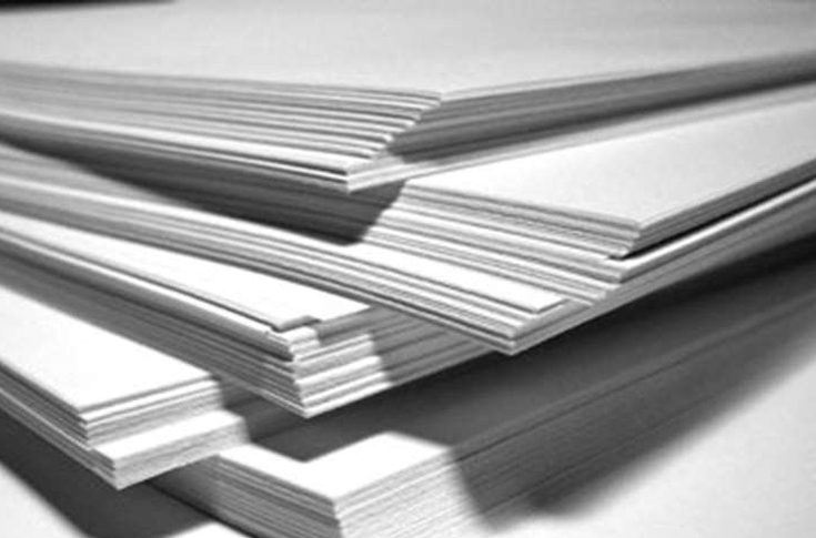 Conceptual illustration of printed paper documents alongside digital screens representing the debate between print and digital communication, highlighting inclusion, accessibility, education, and sustainability in Europe’s paper and printing industry policy discussion