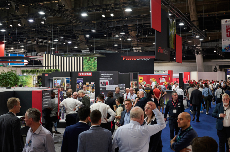 Industry awards presentation showcasing label printing innovations, sustainable adhesives, recyclable inks, and advanced hybrid press technologies evaluated by an international judging panel