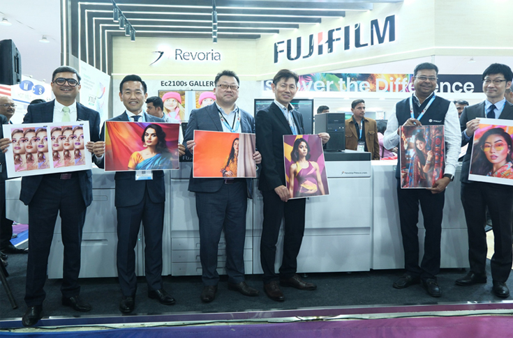 Koji Wada of Fujifilm India presenting the Revoria Press EC2100S and SC285S along with Apeos 4620 SX/SZ multifunction devices at PrintPack India 2025, showcasing advanced digital printing technology
