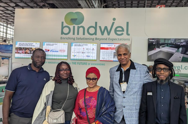 Digital Reality printing facility in Lagos, Nigeria, showing Bindwel BW@2500 book-finishing machine in operation with staff support, representing a women-led leadership team and production setup