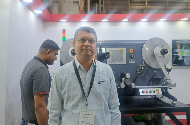 Control Print team presenting digital inkjet printer with DOD printhead technology, high-speed fibre optic communication, and variable data printing capabilities at Labelexpo India exhibition stand