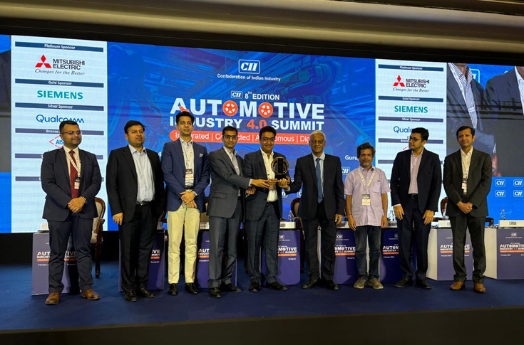 Ankit Gupta and Shobhit Gupta, joint managing directors of Holostik Group, receiving an award at the Automotive Industry 4.0 Summit in Gurugram for environmental sustainability and safety excellence at the Greater Noida plant