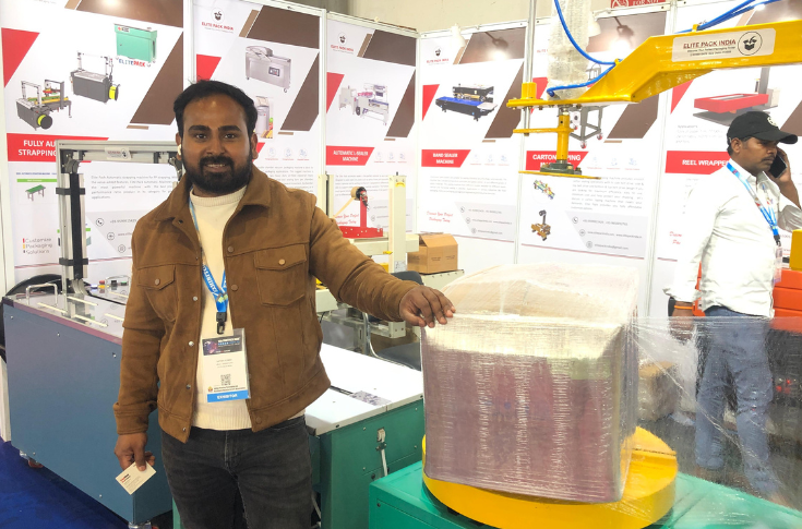 Elite Pack India showcasing high-speed paper wrapping and shrink-wrapping machines at PrintPack 2025 for export and packaging applications