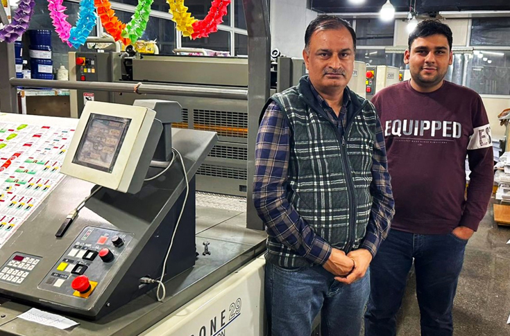 Commercial printing facility using Komori Enthrone 29 offset press for packaging printing alongside digital production and large-format printing equipment
