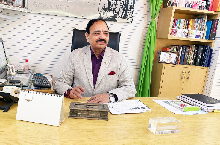 Industry discussion featuring paper-based carton packaging samples and GST policy documents, highlighting cost reduction impacts on MSME packaging and printing businesses in India