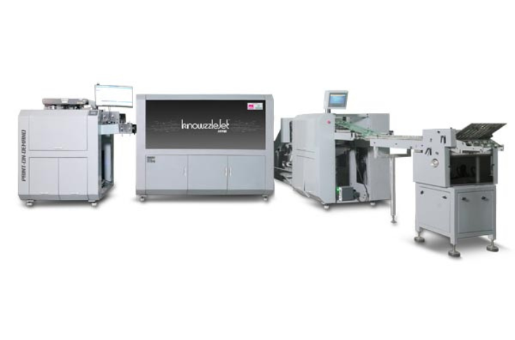 Monotech Systems showcasing the KnowzzleJet inkjet web press at PrintPack India 2025, featuring high-resolution 1600 dpi eco-friendly water-based ink printing with roll-to-roll, roll-to-sheet, and roll-to-fold capabilities