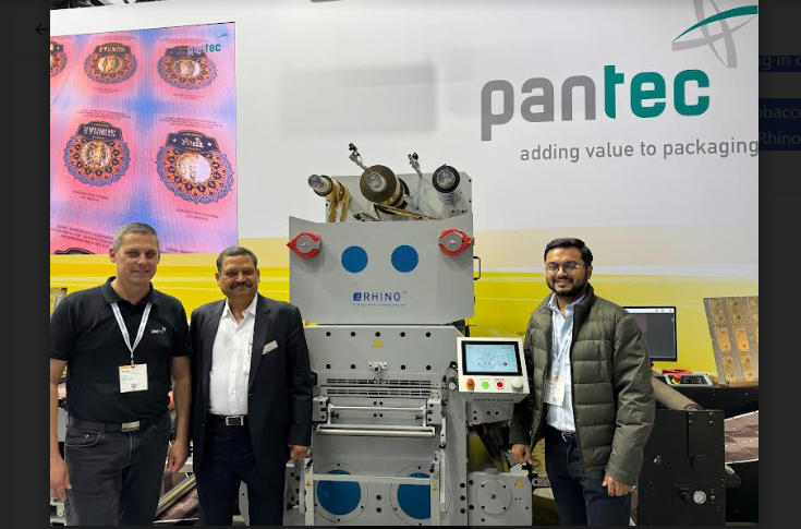 SRK Technology presents Pentac Rhino flatbed embossing system for labels and packaging alongside Cheetah N rotary embellishment system demonstrating 3D image effects on shrink sleeves using heat and pressure transfer technology