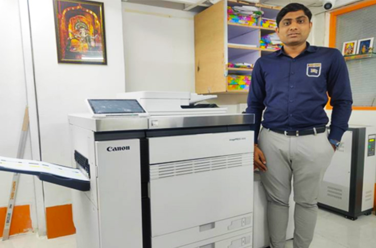 Option Print production facility featuring Canon iPR V800 digital press producing high-quality graphic prints and wide-format printing applications