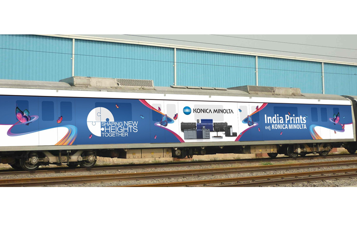 Konica Minolta branded metro train with exterior and interior advertising showcasing business solutions, product portfolio, and campaign messaging across Indian cities