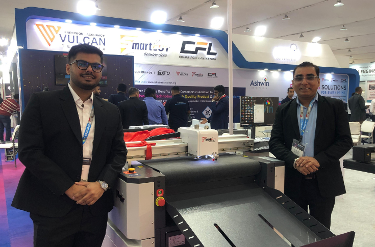 Vinod Bhanushali of Ashwin Enterprises presenting new lami press machines, Tofo laminator, HQ series systems, and Smart Cut 6090 flatbed cutter at PrintPack 2025