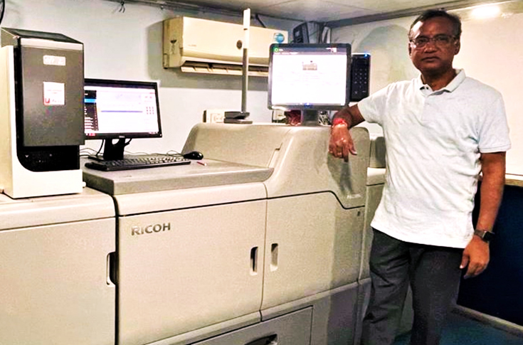 Sanjog Mahapatra and the Auro Graphics team operating Ricoh Pro digital production presses for high-volume commercial printing and advanced graphic production in Bhubaneswar
