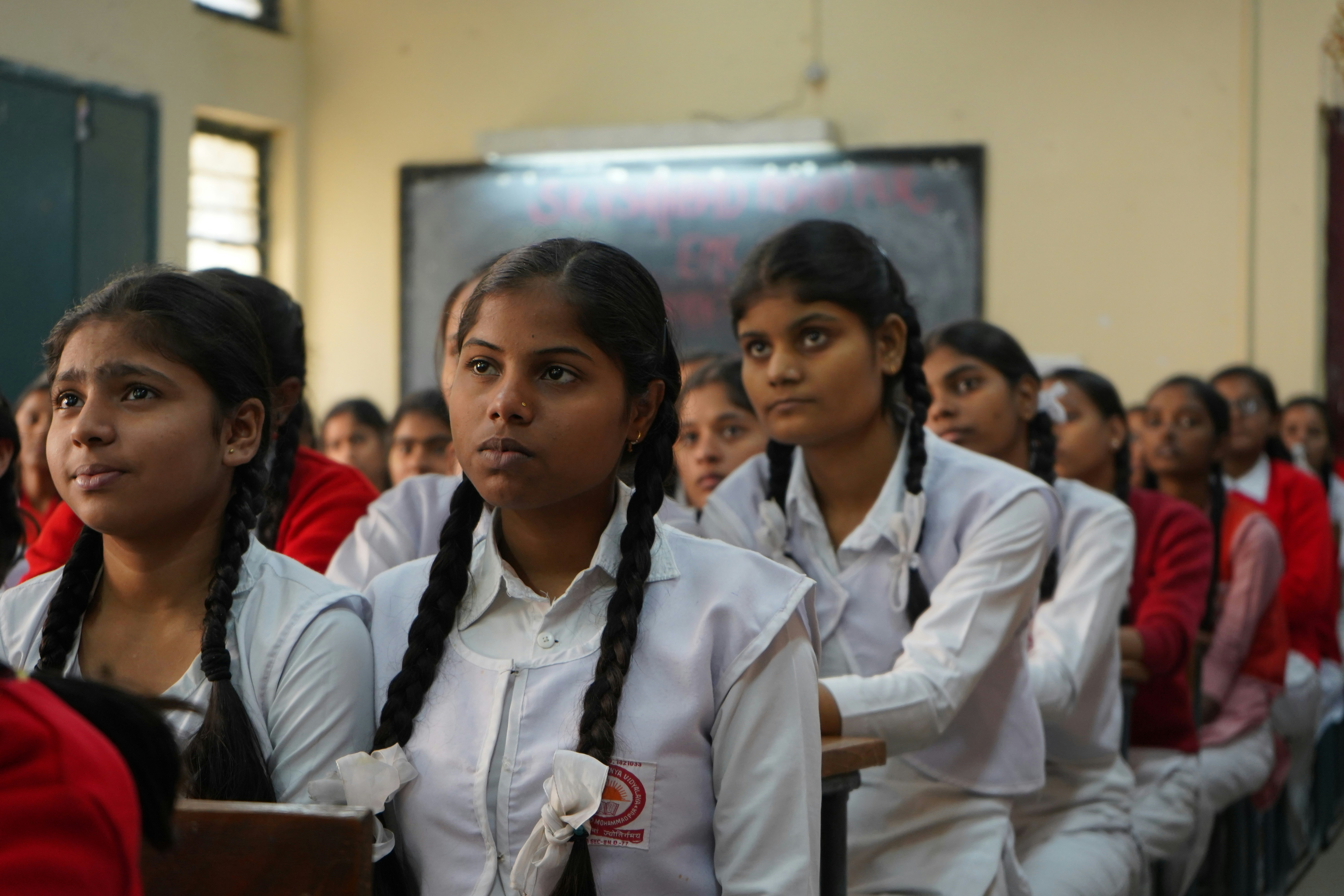 Schoolchildren studying in a classroom as discussions around ASER 2024 highlight literacy, arithmetic skills, and challenges in India’s education system