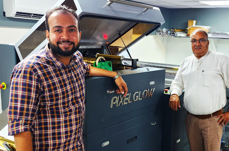 Vijyant Kumar Bindal of Crazy Offset Printers operating the Monotech Systems Ltd PixelGlow UV and foiling system, showcasing high-speed digital embellishment of printed graphics with spot UV, foiling, and textured effects