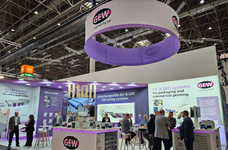 GEW display at Drupa featuring UV curing systems and ArcLED technology for sheetfed offset, flexo, and wide-web printing applications with interchangeable UV Arc and LED lamp systems