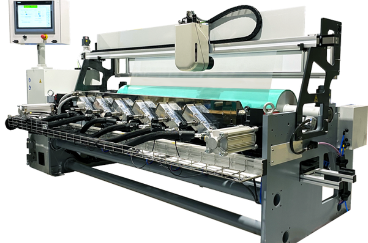 Packaging exhibition showcasing digital foils, release varnishes for multilayer labels, and a compact slitting machine for hot-stamping foil rolls in operation