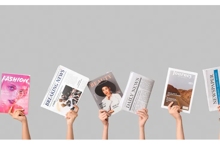 Person reading news across print and digital platforms, representing public trust in traditional media versus AI, influencers, and government in modern journalism