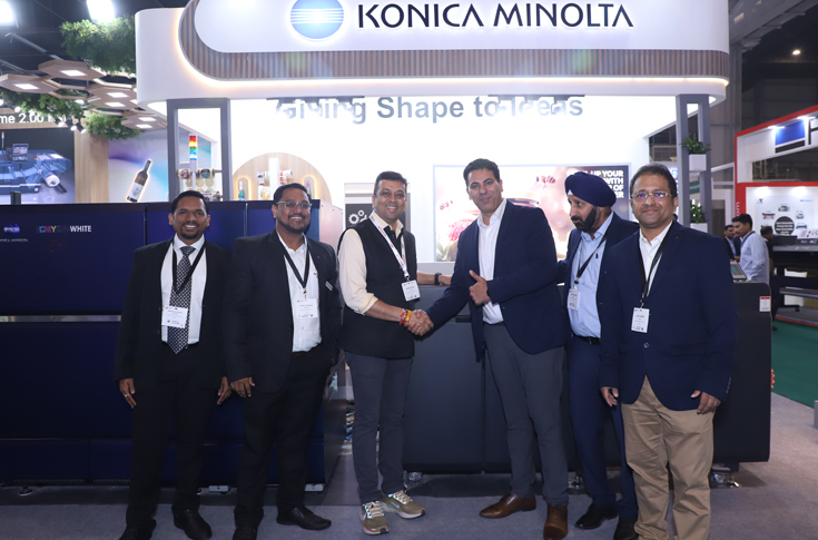Konica Minolta booth at Labelexpo 2024 showcasing AccurioLabel 230 and AccurioLabel 400 digital label presses with live demonstrations of white toner printing on multiple substrates for packaging and label applications