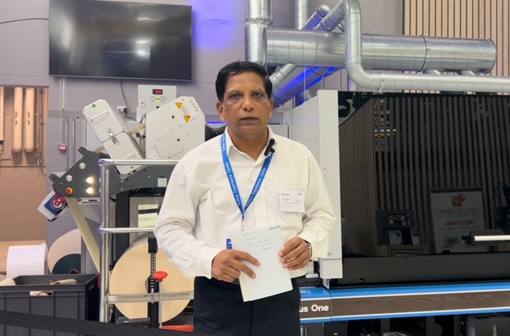 Label industry professional observing modern printing press operations, highlighting the shift to digital workflows, shorter production runs, and flexible label manufacturing environments