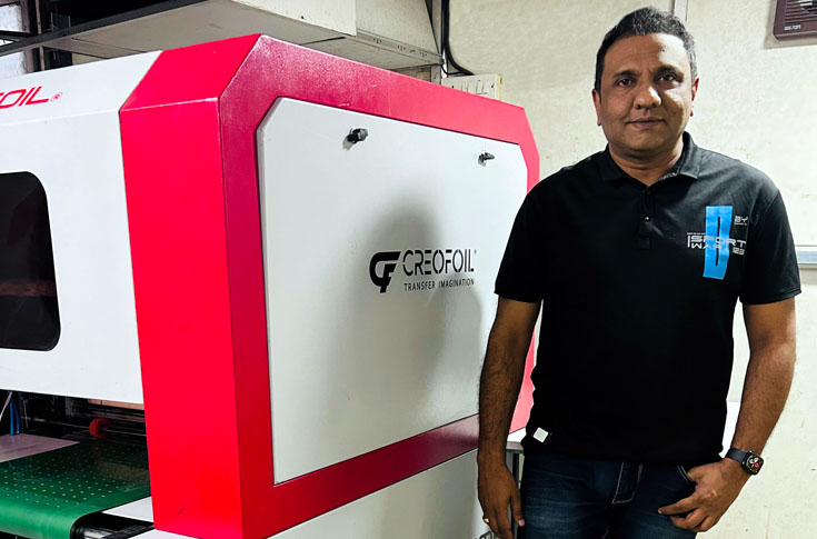 Commercial printing setup showcasing advanced Creofoil machine for enhanced print quality and productivity