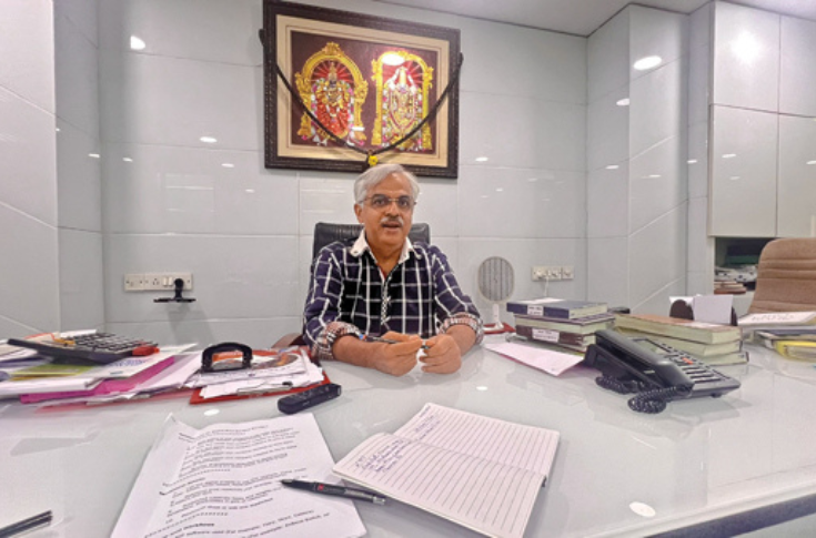 Family-run printing business producing religious deity prints, combining traditional print methods with modern digital production in a high-volume archival design studio