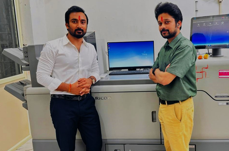Color and Creation team operating Ricoh Pro Series Special Color Edition digital press producing cosmetic labels with special colour and white toner effects