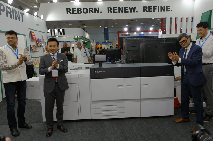 Fujifilm Revoria Press EC1100 and upgraded Revoria PC1120 digital printing presses demonstrating high-speed duplex printing with long-sheet media handling, RGB colour workflow, pink toner enhancements, and Fiery RIP workflow integration for photo album and commercial printing applications