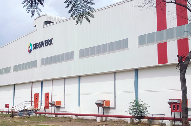 Siegwerk manufacturing facility resuming operations after a fire incident, highlighting emergency response efforts, production recovery, and continued supply support for customers
