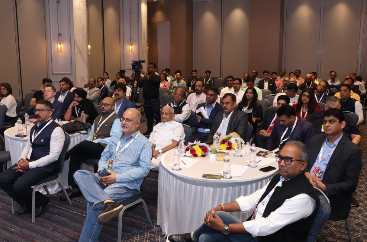 Industry conference panel discussion on printing and packaging featuring experts from BRBNMPL, Natur Tec India, Vijayneha Polymers, RRD, and speakers presenting on smart packaging, sustainability, and digital-offset integration