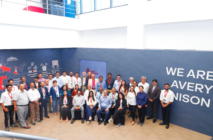 Experts collaborating inside Avery Dennison’s AD InsightX innovation lab near Pune, exploring packaging concepts, digital prototypes, and sustainability-focused solutions in a modern co-creation workspace