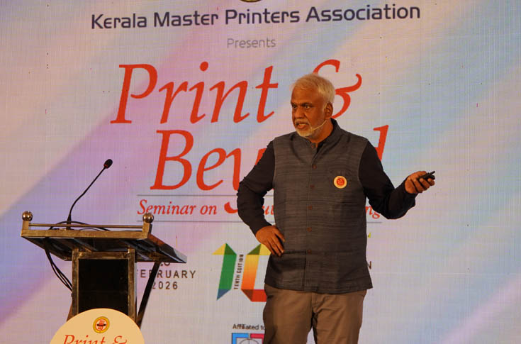 P Sajith delivering a keynote at Print & Beyond 2026 in Kochi, discussing India’s textbook printing scale, industry strengths, and strategies for balancing local values with global opportunities