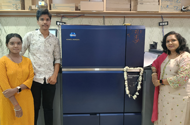 Konica Minolta digital printing press installed at Chitra Colour Lab with operators managing high-quality commercial printing and advanced production technology in a modern print facility