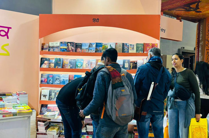 New Delhi World Book Fair 2026 showcasing multilingual book stalls with Hindi, Bengali, Marathi, Malayalam, Urdu, and other regional language publications, including the Kudopali epic available in 13 languages, reflecting India’s linguistic diversity and mother-tongue education focus