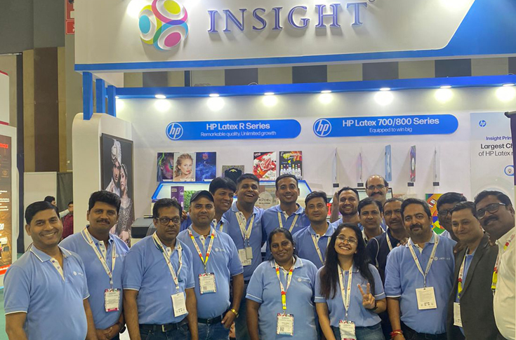 Insight Print Communications booth displaying HP Latex 630W, HP Latex 700W, and HP Latex R Series printers with signage and décor print applications on wood, acrylic, vinyl, wallpaper, and other rigid and flexible media at Media Expo
