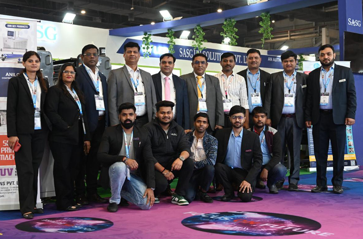 SASG UV Solutions booth at a printing and packaging exhibition showcasing Drip Master and High Drip Master UV coating machines, Anilox coater attachments, and industrial UV curing systems designed for high-speed spot UV and flood UV applications on varied substrates
