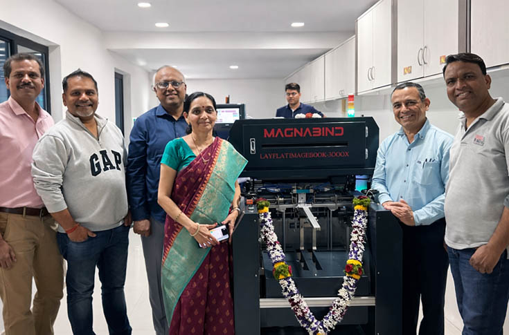 Automated photo album production machine creating layflat wedding albums with precise binding and alignment, showcasing industrial-scale printing and finishing technology in India’s photo album manufacturing sector