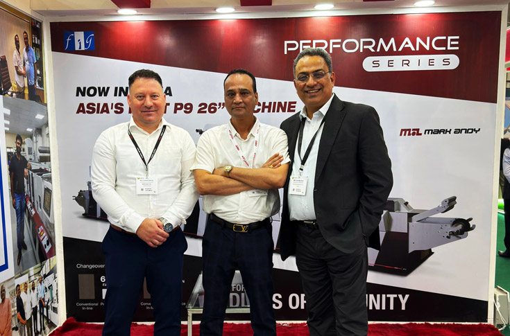 Barcom Industries team and FIG representatives discussing Mark Andy presses and Rotoflex inspection systems used in label manufacturing upgrades
