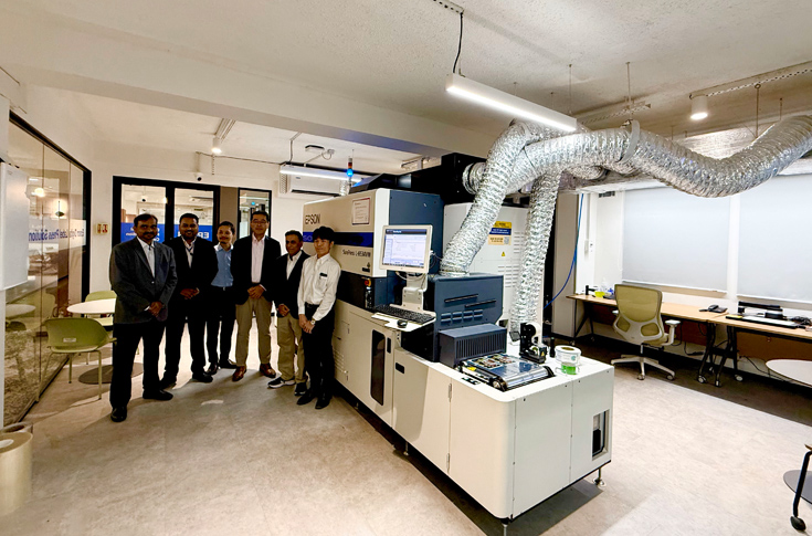 Epson SurePress L-6534VW digital label press at Solution Centre in New Delhi demonstrating high-speed UV inkjet printing with advanced precision and varnish capability