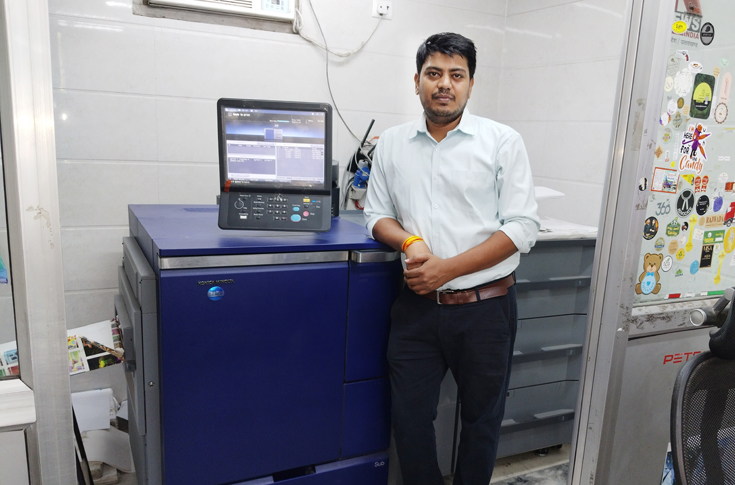 Sagar Digital Printers facility operating Konica Minolta AccurioPress C7090 digital production press alongside previous generation models, highlighting high-quality commercial printing services and smooth equipment transition