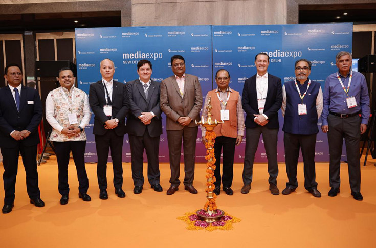 Media Expo exhibition hall with 125 exhibitors from India, Italy, Korea, and China showcasing signage, printing, and advertising technologies with industry professionals networking and exploring new solutions