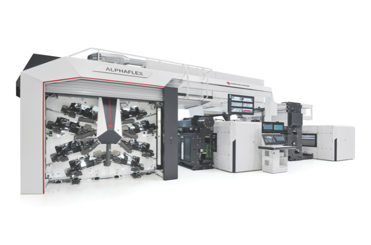 Windmöller & Hölscher Alphaflex CI flexographic printing machine operating in flexible packaging production with multiple print decks, alongside advanced CI flexo and gravure printing systems